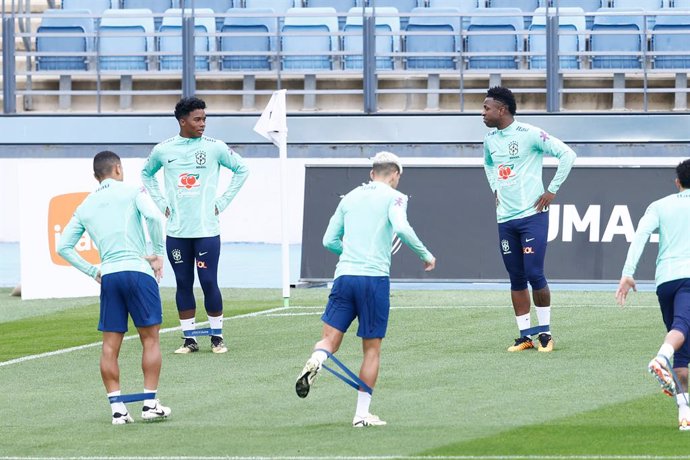 Endrick Felipe talks to Vinicius Junior during the training session of Brazil Team prior the friendly match against Spain at Ciudad Deportiva Real Madrid on March 25, 2024, in Valdebebas, Madrid, Spain.