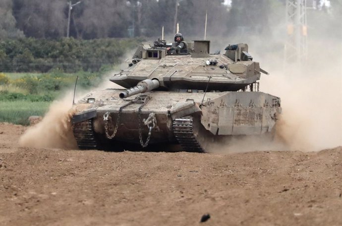 NIR AM, March 21, 2024  -- An Israeli tank maneuvers amid the ongoing Israel-Hamas conflict near Nir Am, a kibbutz in southern Israel, on March 21, 2024. the Hamas-run Ministry of Health in Gaza said Thursday in a statement that the Israeli army killed 65