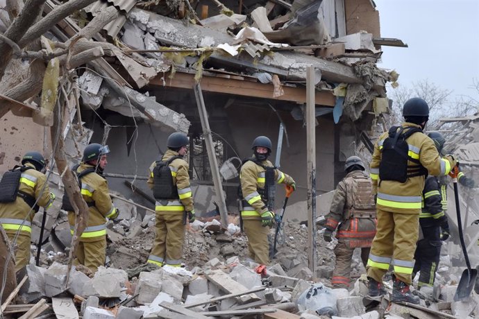 March 22, 2024, Zaporizhzhia, Ukraine: Ukrainian State Emergency Service firefighters seen during the inspection of a destroyed private house (looking for a little girl and her father) following the Russian missile attack in Zaporizhzhia. Russia launched 