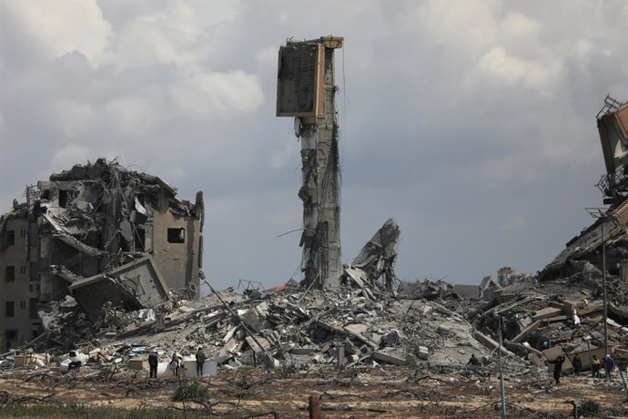 March 25, 2024, Nuseirat, Gaza Strip, Palestinian Territory: People search the rubble of destroyed buildings in the Asra residential compound, northwest of Nuseirat in the Gaza Strip, on March 25, 2024,Image: 859457164, License: Rights-managed, Restrict