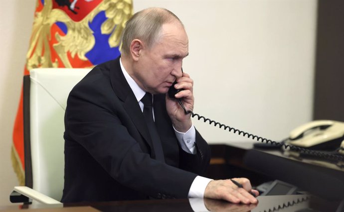 HANDOUT - 23 March 2024, Russia, Moscow: Russian President Vladimir Putin speaks over the phone during his address, the day after a terror attack on the Crocus City Hall in Krasnogorsk. Photo: -/Kremlin/dpa - ATTENTION: editorial use only and only if the 