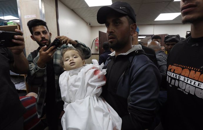 March 27, 2024, Dair El-Balah, Gaza Strip, Palestinian Territory: Relatives of A Palestinian Child, Yasmeen Abu Rkab, 2, died in Israeli attacks, mourn as they receive her body from the morgue of Al-Aqsa Hospital for burial in Dair El-Balah, Gaza on March