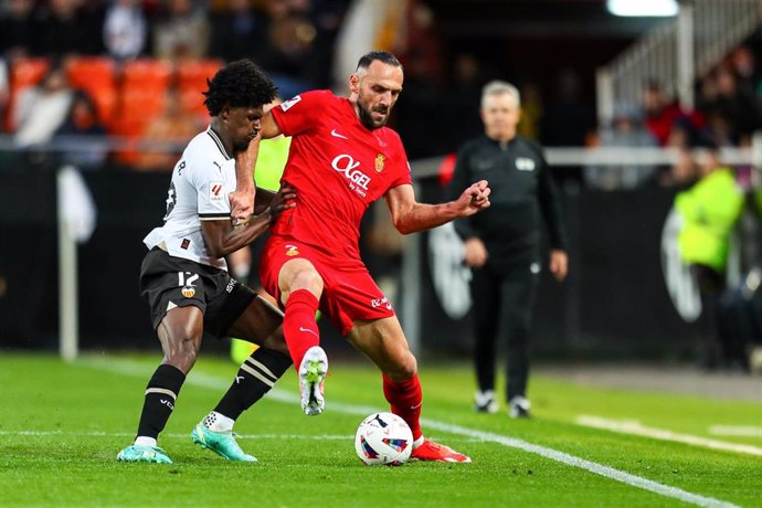 Vedat Muriqi of Mallorca and Thierry Correia of Valencia in action during the Spanish league, La Liga EA Sports, football match played between Valencia CF and RCD Mallorca at Mestalla stadium on March 30, 2024, in Valencia, Spain.