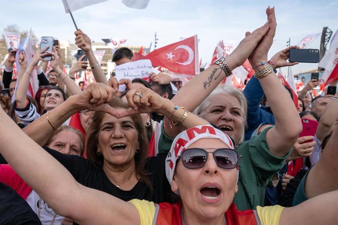 March 30, 2024, Besiktas, Istanbul, Turkey: Supporters of Istanbul Metropolitan Municipality Mayor and opposition mayor candidate Ekrem Imamoglu, wave Turkish flags and shout slogans during campaign rally in Besiktas, Istanbul, ahead of Turkish Local elec
