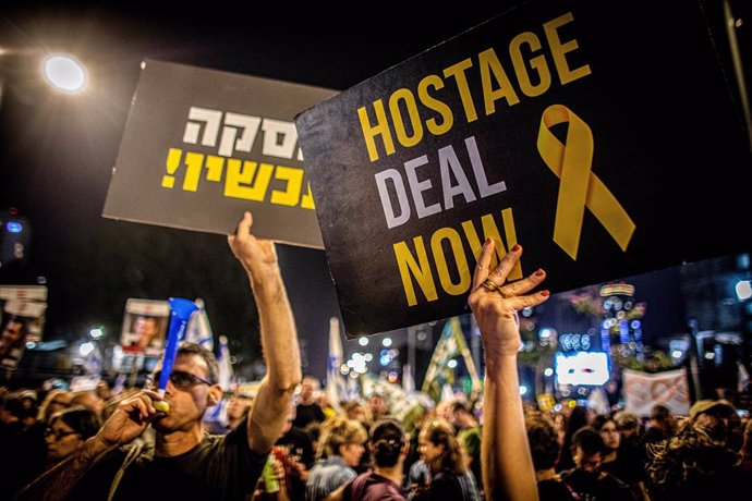 March 30, 2024, Tel Aviv, Israel: Protestors hold up placards during a protest  in Tel Aviv Saturday, March 30 2024. On Saturday, tens of thousands took to the across Israel in the largest protest since Oct 7 against the current government led by Prime Mi