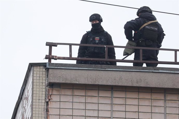 March 2, 2024, Saint-Petersburg, Russia: Policemen seen on top of the building around a damaged residential building after an alleged drone attack, which was reported by local media at Krasnogvardeisky district. The Russian Ministry of Emergency Situation