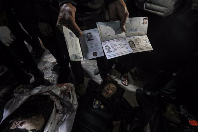 April 2, 2024, Deir Al-Balah, Gaza Strip, Palestinian Territory: Bodies of the officials working at the US-based international volunteer aid organization World Central Kitchen (WCK) are seen after an Israeli attack on a vehicle belonging to WCK in Deir Al