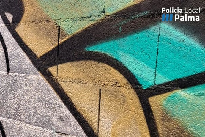 Imagen detalle de la pintada realizada en un muro del centro de Palma.