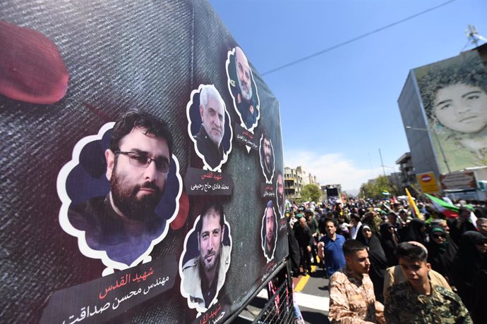 TEHRAN, April 5, 2024  -- People take part in a funeral procession for the seven Iranians killed in the Israeli attack on the consular section of the Iranian embassy in the Syrian capital Damascus, on International Quds Day in Tehran, Iran, on April 5, 20