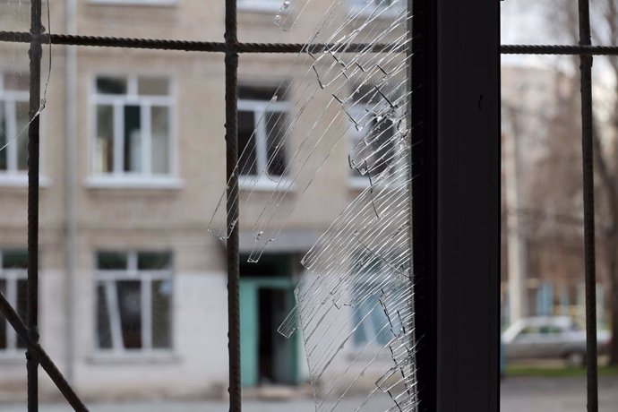 April 6, 2024, Kharkiv, Ukraine: KHARKIV, UKRAINE - APRIL 6, 2024 - Broken glass stays in a window frame at a school after a Russian precision-guided munition attack, Kharkiv, northeastern Ukraine.