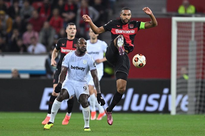 Leverkusen's Jonathan Tah (above) and West Ham's Michail Antonio (below) battle for the ball during the UEFA Europa League quarter-final first leg soccer match between Bayer Leverkusen and West Ham United at BayArena. Photo: Marius Becker/dpa