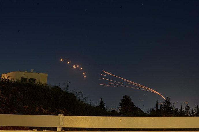 HULA VALLEY, April 12, 2024  -- Israel's Iron Dome defense system launches missiles to intercept rockets fired from Lebanon, as seen over Hula Valley, northern Israel, on April 12, 2024. About 40 rockets were fired from Lebanon at northern Israel on Frida