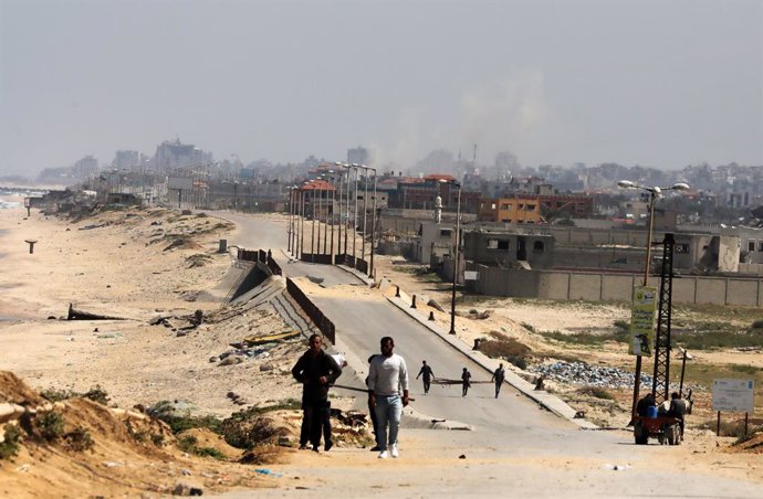 April 12, 2024, Nusairat, Gaza Strip, Palestinian Territory: Smoke rises during an Israeli military operation in Al Nusairat refugee camp south of Gaza City. More than 33,500 Palestinians and over 1,450 Israelis have been killed, according to the Palestin