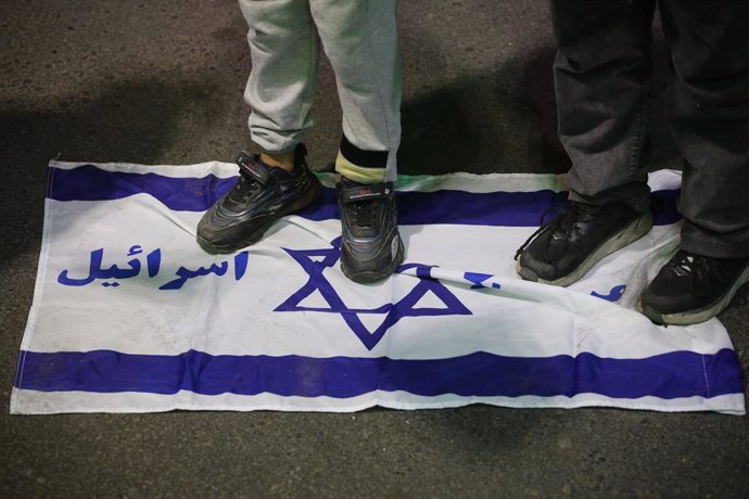 April 1, 2024, Tehran, Iran: Iranian children stand on the Israel flag during an anti-Israeli demonstration at Palestine Square in Tehran after Israel launched an airstrike targeting the Iranian consulate building in Damascus. An Israeli airstrike that de