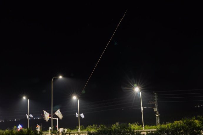 KIRYAT SHEMONA, April 14, 2024  -- This long exposure photo taken on April 14, 2024 shows traces of miles and flares from explosions in the sky over Kiryat Shemona as Israel's anti-missile system intercepts missiles and drones from Iran. A combined attack
