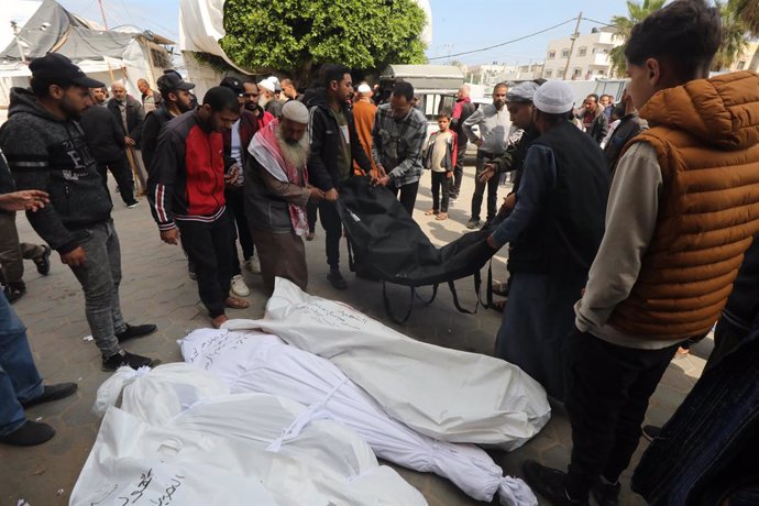 April 14, 2024, Dair El-Balah, Gaza Strip, Palestinian Territory: Relatives of the Palestinians died in Israeli attacks, mourn as they receive the dead bodies from the morgue of Al-Aqsa Hospital for burial in Dair El-Balah, Gaza on April 14, 2024