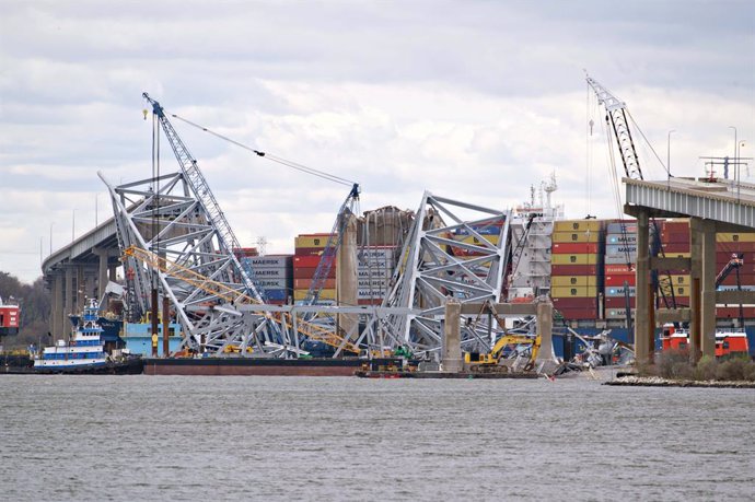 April 5, 2024, Dundalk, Md, United States of America: A tangle of metal trusses and cranes surround the collapsed Francis Scott Key Bridge during the visit of U.S President Joe Biden seen from Sollers Point, April 5, 2024 in Dundalk, Maryland. The bridge 