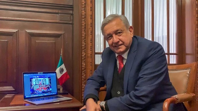 Archivo - 19 December 2019, Mexico: Mexican President Andres Manuel Lopez Obrador is pictured as he follows on a laptop the session of the US House of Representatives where they approved the United States-Mexico-Canada Agreement (T-mec) 