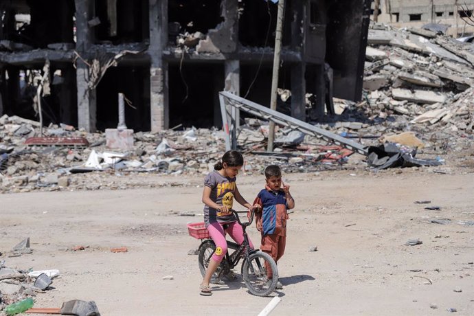 GAZA, April 14, 2024  -- Children play near debris in Gaza City, April 13, 2024. The Islamic Resistance Movement (Hamas) announced Saturday it has responded to mediators in Egypt and Qatar over the proposed ceasefire in the Gaza Strip and reaffirmed its d