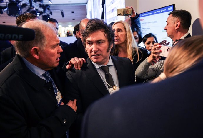 Archivo - 17 January 2024, Switzerland, Davos: Javier Milei, President of Argentina, is escorted out of the building after his speech at the World Economic Forum. 