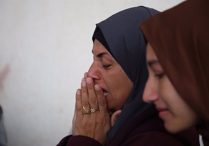 GAZA, April 16, 2024  -- A woman grieves over victims killed in an Israeli airstrike in the southern Gaza Strip city of Rafah, on April 16, 2024. The Ministry of Health in Gaza announced Tuesday that the Palestinian death toll from ongoing Israeli attacks