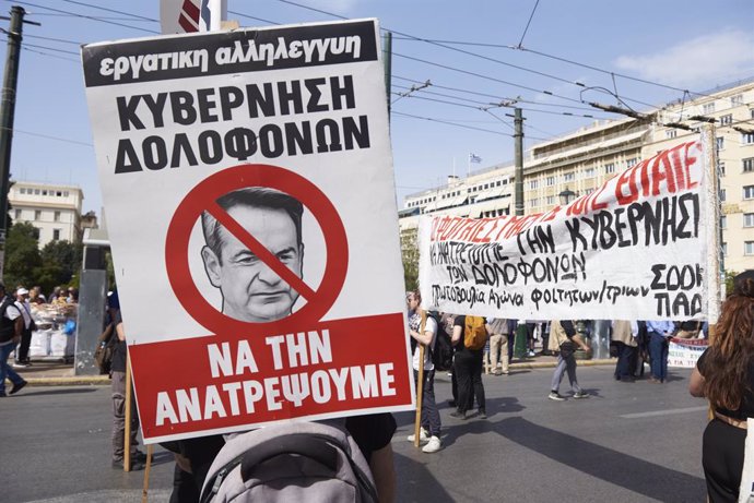 April 17, 2024, Athens, Greece: Protesters wave flags and shout slogans against the rising cost of living, as they march to the greek parliament. Thousands took to the streets participating in a 24 hour general strike called by private sector unions,