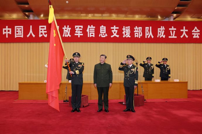 BEIJING, April 19, 2024  -- Chinese President Xi Jinping, also general secretary of the Communist Party of China (CPC) Central Committee and chairman of the Central Military Commission (CMC), presents a flag to the information support force of the Chinese
