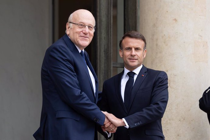 April 19, 2024, Paris, France, France: French President Emmanuel Macron (R) welcomes Lebanese Prime Minister Najib Mikati (L) before a meeting at the Elysee Palace.
