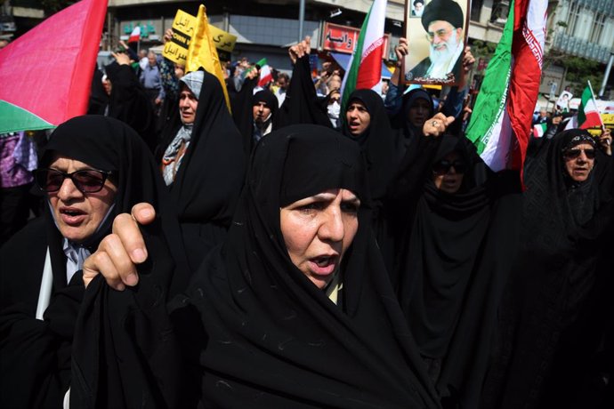 April 19, 2024, Tehran, Iran: Iranian veiled women in black Chadors chant slogans during an anti-Israel rally in Tehran. Air defense systems over the central city of Isfahan destroyed three aerial objects early on April 19. The explosions come after a dro