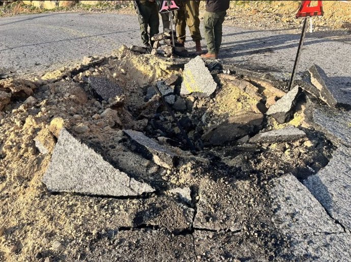 April 14, 2024, Israel: A crater is seen in a road in the Mount Hermon area, following an Iranian ballistic missile strike, April 14, 2024.'