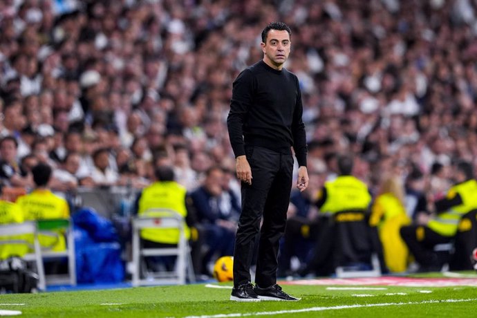 Xavi Hernandez, head coach of FC Barcelona, looks on during the Spanish League, LaLiga EA Sports, football match played between Real Madrid and FC Barcelona at Santiago Bernabeu stadium on April 21, 2024 in Madrid, Spain.