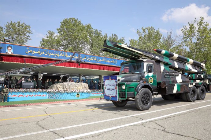 HANDOUT - 17 April 2024, Iran, Tehran: A missile is carried on a truck during a ceremony on the Army Day of the Islamic Republic of Iran at the Army Ground Forces Headquarters. Photo: Mohammad Javad Ostad/Iranian Presidency/dpa - ATTENTION: editorial use 