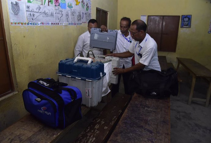 April 25, 2024, Guwahati, Guwahati, India: Election polling and presiding officials reach in a polling station along with Electronic Voting Machine  on the eve of 2nd phase of Lok Sabha Election 2024 at Tuplia in a Polling station in Baksa district of Ass