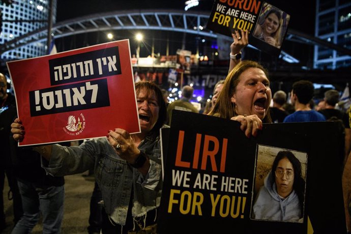 March 30, 2024, Tel Aviv, Israel: Israeli women shout as they hold placards of the Israeli female hostages following recent evidence on sexual violence in Hamas captivity. Tens of thousands of people demonstrated with the hostages families against Prime M