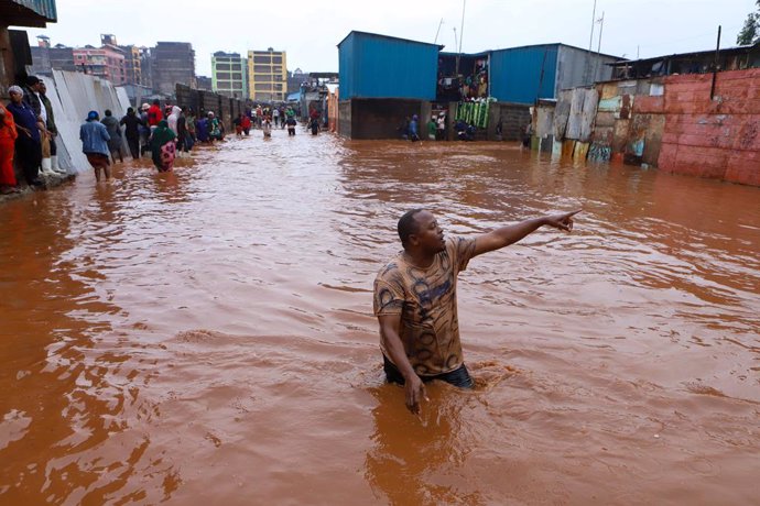 NAIROBI, April 24, 2024  -- A man reacts as he walks through floodwater after heavy rains in the Mathare slums of Nairobi, Kenya, on April 24, 2024. Kenya is experiencing heavy rains that have disrupted normal business across the East African country, res