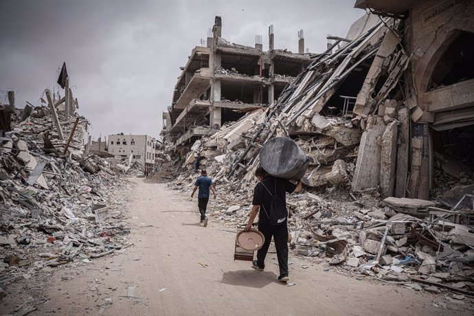 April 26, 2024, Gaza, Gaza, Palestine: Palestinians roam the destroyed streets of Khan Younis