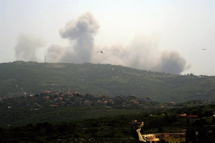 AITA AL-SHAAB, April 24, 2024  -- Photo taken on April 24, 2024 shows smoke rising following Israeli air strikes in the Lebanese border town of Aita al-Shaab. Exchanges of fire across the Lebanese-Israeli border saw an unprecedented escalation on Wednesda