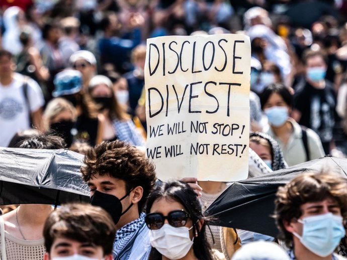 April 29, 2024, New York, New York, USA: A sign held by a student marching around the encampment reads "Disclose Divest We will not stop! We will not rest!". During the afternoon Columbia University supposedly started suspending students that are at the