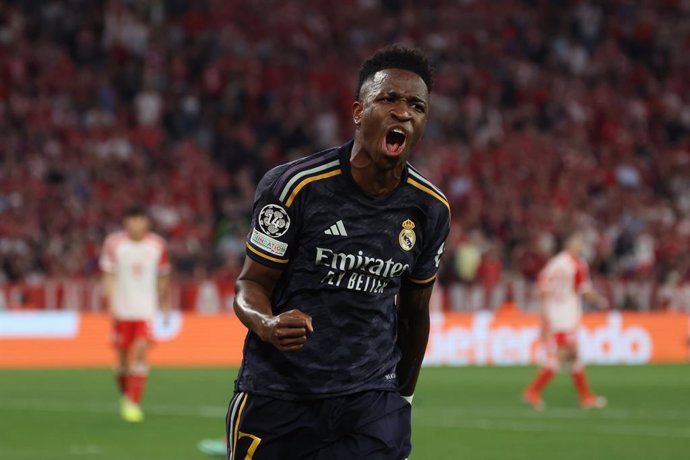30 April 2024, Bavaria, Munich: Real Madrid's Vinicius Junior celebrates scoring his side's second goal during the UEFA Champions League semi-final first leg soccer match between Bayern Munich and Real Madrid at Allianz Arena. Photo: Matthias Balk/dpa