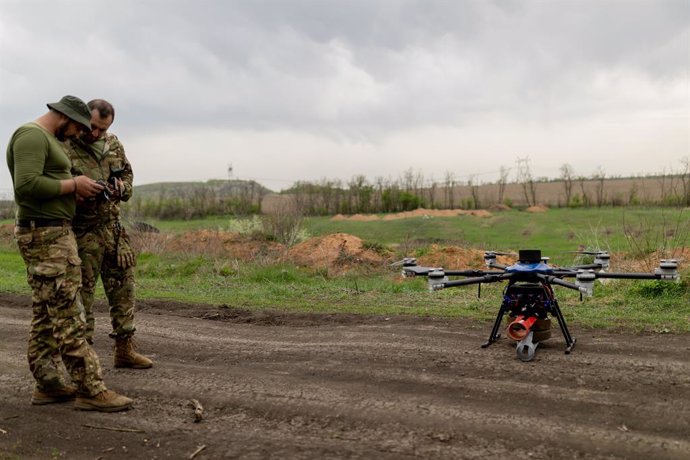 April 18, 2024, Donetsk Region, Ukraine: Two soldiers piloting Military Drones of the Ukrainian Army, preparing the radio link to the controller, before starting flight tests, to improve their piloting skills during battlefield missions.