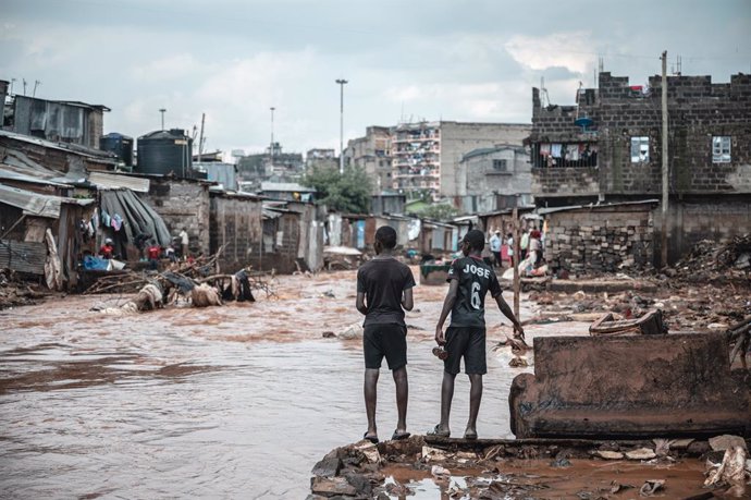 NAIROBI, April 30, 2024  -- People are seen in a flood-affected area in the Mathare slums in Nairobi, Kenya, on April 30, 2024. Heavy rains pounding several parts of Kenya and devastating flash floods have left 169 people dead, a government official said.