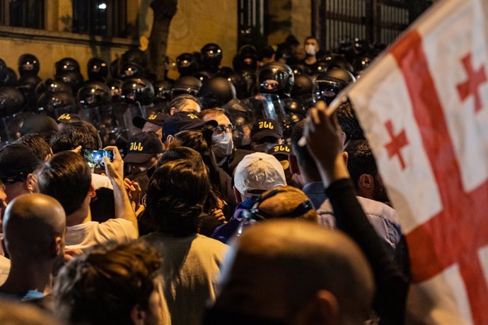 April 28, 2024, Tbilisi, Georgia: Protesters seen in front of the police during a protest against the reintroduction of a bill on 'foreign agents in central Tbilisi.
