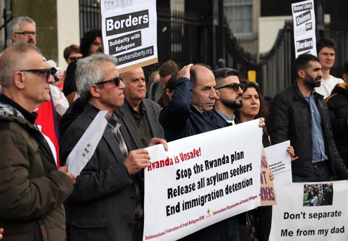 May 1, 2024, London, United Kingdom: Protesters hold signs in solidarity with refugees during the demonstration. Protesters demonstrate opposite Downing Street in support of refugees. They make it clear they believe the Rwanda flights are unacceptable as 