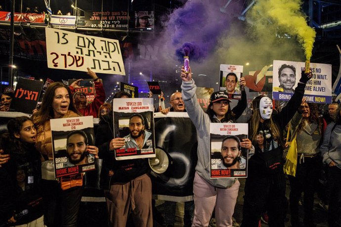 March 23, 2024, Tel Aviv, Israel: Family members of Israeli hostage Matan Zangauker hold up torches and signs with his photos that reads ''Bring Him Home Now''. Thousands of protesters against Prime Minister Benjamin Netanyahu joined the Israeli hostage f