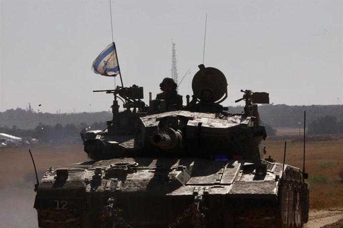SHALOM KEREM CROSSING, May 6, 2024  -- An Israeli tank is seen near the Shalom Kerem crossing in southern Israel bordering the Gaza Strip, on May 6, 2024. Israeli media reported on Monday that Israel's war cabinet has approved the launch of a ground offen