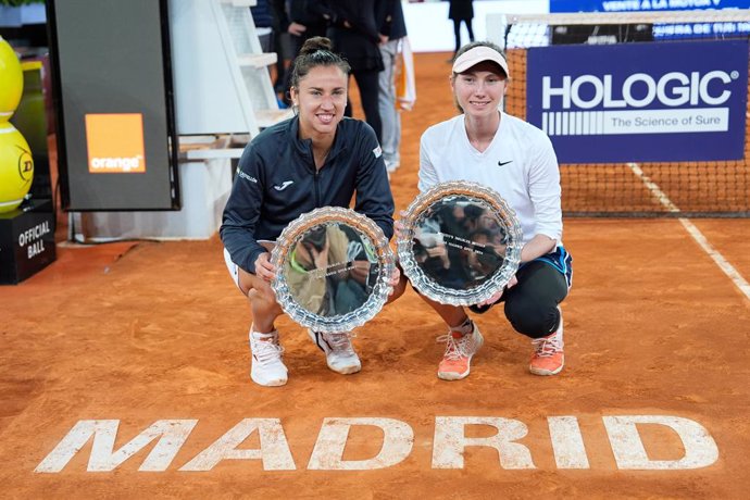 Cristina Bucsa and Sara Sorribes of Spain pose for photo with the winners trophy after winning the Final match against Laura Siegemund of Germany and Barbora Krejcikova of Czech Republic during the WTA Doubles Final of the Mutua Madrid Open 2024, ATP Mast