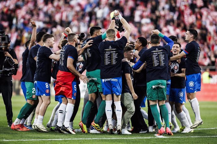 Players of Girona FC celebrate qualification for the Champions League during the Spanish league, La Liga EA Sports, football match played between Girona FC and FC Barcelona at Estadio de Montilivi on May 04, 2024 in Girona, Spain.