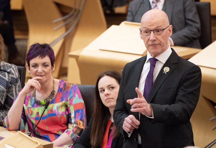 09 May 2024, United Kingdom, Edinburgh: First Minister of Scotland John Swinney (R) speaks during First Minster's Questions at the Scottish Parliament in Holyrood, Edinburgh. Photo: Lesley Martin/PA Wire/dpa