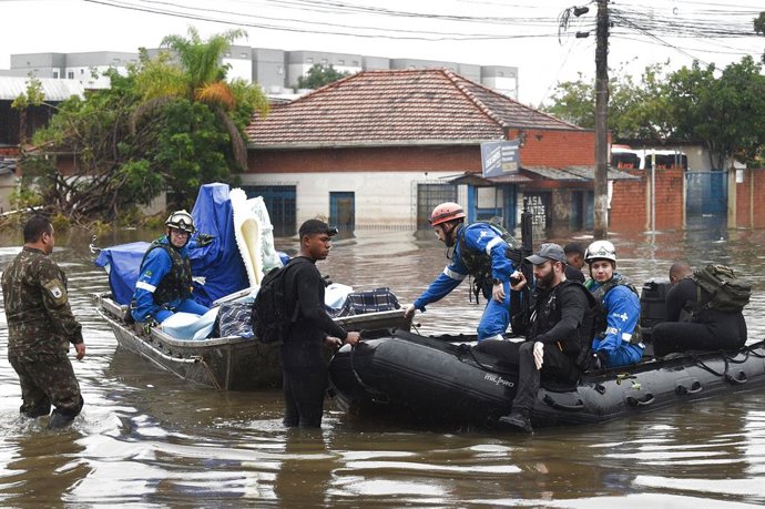 RIO GRANDE DO SUL, May 12, 2024  -- Rescue team members transfer equipment and medicine from a flooded hospital in Canoas, Rio Grande do Sul state, Brazil, May 10, 2024. The death toll from the storms and floods in south Brazil's Rio Grande do Sul state h