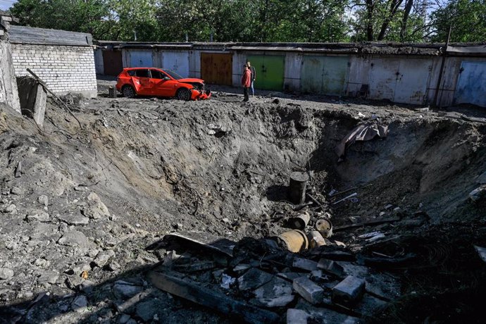 May 8, 2024, Zaporizhzhia, Ukraine: A crater is seen on the premises of a garage cooperative after the nighttime massive Russian missile and drone attack, Zaporizhzhia, southeastern Ukraine.